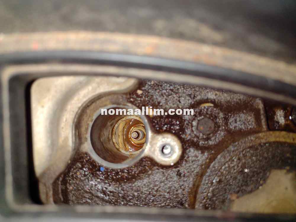 Water in spark plug well