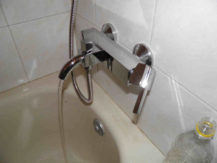 Replacing a shower mixer tap